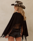 black Faux suede long sleeve top
Fringe hem
Adjustable sleeve tie
Unlined