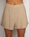 Woven high waisted linen shorts
Zipper button closure
Belt loops
Faux back pocket
Side pockets
Bottom fold up detail
Unlined
Summer tan linen shorts
Resort wear