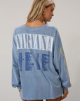 blue Graphic printed acid wash knit top. Crewneck. Long sleeves. Unlined.