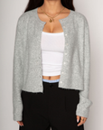 Fuzzy knit cardigan. Front button down closures. Unlined. grey knit cardigan. grey oversized cardigan