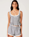 Gingham printed tank top
Figure-hugging bodice with peplum hem
Bodice pleating
Scoop neck with delicate trim bow detailing
Front hook eyelet closure
black and white gingham tank top