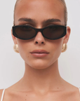 brown Oval tort sunglasses
Gold hardware engraved with Banbé logo on outer left arm
Style details printed in gold foil on inner right arm
Scratch resistant/category 3/polarised lens
100% UV protection
Acetate frame
Width: 3.8", Lens Height: 1.1", Arm Length: 5.5", Nose Bridge: 0.7"