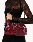crinkly maroon burgundy clutch bag by billini