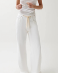 Cut to sit low on the hips
Relaxed rise
Easy adjustable drawstring waist tie
Wide, fluid leg
Constructed from non-stretch denim
Size 26 measurements:
Rise: 11" / Inseam: 32 1/2" / Leg Opening: 24"
Cotton/Lyocell
white denim jeans