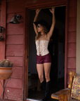 Embroidered knit corset
Adjustable halter tie neck
Front lace up closure
Back hook and eye and zipper closures
Fully lined
Studded details
Coachella outfit
Stagecoach outfit
Festival Outfit