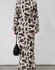 Printed chiffon maxi dress. Long bell sleeves. Adjustable crisscross back straps. Side slit. Fully lined. Dinner dress. Classy dinner dress. Fancy dinner dress. Nice dinner dress. Dressed up vacation outfits. Dress to wear on vacation. Nice dress to wear on vacation. Open back dress
