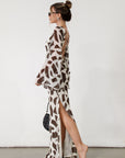 Printed chiffon maxi dress. Long bell sleeves. Adjustable crisscross back straps. Side slit. Fully lined. Dinner dress. Classy dinner dress. Fancy dinner dress. Nice dinner dress. Dressed up vacation outfits. Dress to wear on vacation. Nice dress to wear on vacation. Open back dress
