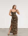 Animal printed knit maxi dress. Adjustable straps. Side slits. Unlined.
