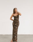 Animal printed knit maxi dress. Adjustable straps. Side slits. Unlined.