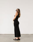 black Ribbed knit maxi dress. Twisted straps. Ruched sides. Unlined.