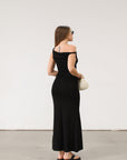 black Ribbed knit maxi dress. Twisted straps. Ruched sides. Unlined.