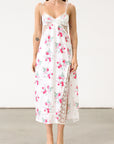 Floral printed satin maxi dress. Adjustable tie straps. Front slot. Adjustable back tie closures. Unlined for love and lemons dress. floral slip dress with lace detail and slit.