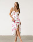 Floral printed satin maxi dress. Adjustable tie straps. Front slot. Adjustable back tie closures. Unlined for love and lemons dress. floral slip dress with lace detail and slit.