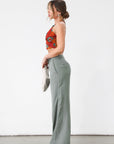 Woven wide leg pants. Low slung palazzo pant. No stretch. Button and zipper fly. Side pockets. Faux back pockets. Unlined. Green pants. Green trousers. Olive trousers. Business casual pants