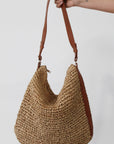Straw woven bag. Vegan leather adjustable strap. Top zipper closure. Inner pockets. Fully lined. 