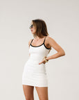 Ribbed knit dress. Elastic straps. Scoop back. Fully lined. Contrast.