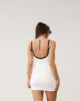 Ribbed knit dress. Elastic straps. Scoop back. Fully lined. Contrast..