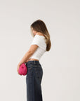 Knit Tube top. Strapless neckline. Front wire. Ruched bodice. Back cut out. Partially lined