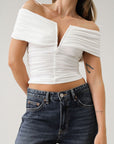 Knit Tube top. Strapless neckline. Front wire. Ruched bodice. Back cut out. Partially lined