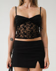 Knit and lace crop tank top. Adjustable straps. Partially lined.