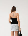 Knit Tube top. Elastic strapless neckline. Inner rubber grip lining. Ruched sides. Front slit. Unlined. Black tube top.