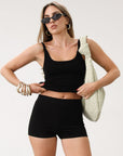 Ribbed knit tank top. Elastic neckline. Unlined. Basic tank top. Black basic tank top. Minimal tank top