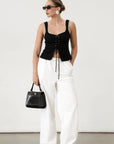 Woven crop top. Fixed straps. Front lace up closure. Side hook and eye and zipper closures. Fully line. black tank top. black top with white outline. summer top. top for summer. going out top. european summer aesthetic