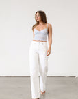 Knit lace cropped tank top. Elastic straps. Elastic back neckline. Ribbed knit back panel. Unlined. Baby blue lace tank top.