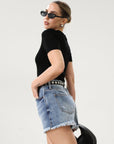 High-waisted faded and distressed denim shorts. Button and zipper fly closures. Five pocket construction. Frayed hem. True to size. Size up for a more relaxed look.