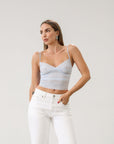 Knit lace cropped tank top. Elastic straps. Elastic back neckline. Ribbed knit back panel. Unlined. Baby blue lace tank top.