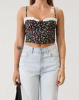 Floral printed woven cropped tank top. Adjustable straps. Boning in bodice. Elastic back strap with hook and eye closures. Back zipper closure. Fully lined.