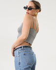 Ribbed knit cropped tank top. Adjustable straps. Lettuce edge hem. Unlined. basic crop top. basic tank top. basic grey tank top. grey tank top. grey crop tank top. everyday tank top