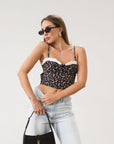 Floral printed woven cropped tank top. Adjustable straps. Boning in bodice. Elastic back strap with hook and eye closures. Back zipper closure. Fully lined.