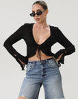 Faded and distressed denim bermuda shorts. Button and zipper fly. Five pocket construction. Frayed hem. Minimal stretch.