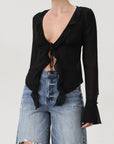 Faded and distressed denim bermuda shorts. Button and zipper fly. Five pocket construction. Frayed hem. Minimal stretch.
