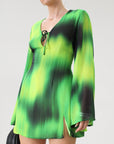 Chiffon dress. Long bell sleeves. V-neckline with tie closure. Front slit. Back hook and eye and zipper closures. Partially lined. green dress. beach vacation dress. green mini dress. mexico dress. miami dress. going out dress