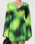Chiffon dress. Long bell sleeves. V-neckline with tie closure. Front slit. Back hook and eye and zipper closures. Partially lined. green dress. beach vacation dress. green mini dress. mexico dress. miami dress. going out dress