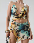 Knit mesh dress. Adjustable halter tie neck. Elastic waist. Ring detail. Side slit. Fully lined. Sexy mini dress. Tie dye mini dress. Dress with cutout. Miami dress. mexico dress. dresses to wear out