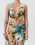 Knit mesh dress. Adjustable halter tie neck. Elastic waist. Ring detail. Side slit. Fully lined. Sexy mini dress. Tie dye mini dress. Dress with cutout. Miami dress. mexico dress. dresses to wear out