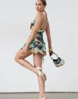Knit mesh dress. Adjustable halter tie neck. Elastic waist. Ring detail. Side slit. Fully lined. Sexy mini dress. Tie dye mini dress. Dress with cutout. Miami dress. mexico dress. dresses to wear out