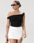 Knit crop top. Elastic straps. Ruched sides. Fully lined.. basic black top. going out top. black going out top. asymmetrical top. off the shoulder top