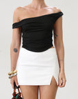 Knit crop top. Elastic straps. Ruched sides. Fully lined.. basic black top. going out top. black going out top. asymmetrical top. off the shoulder top