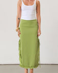 Satin maxi skirt. Side hook and eye and zipper closures. Side slits. Tie details. Lace trim. Fully lined. Green skirt.