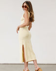 Floral knit midi dress. Sleeveless. Side slit. Back cut out. Unlined. Yellow dress. Yellow floral dress.