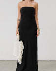 Linen woven maxi dress. Strapless neckline. Elastic back. Back zipper closure. Unlined. Black maxi dress. Black tie dress. Wedding guest dress.
