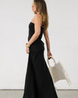 Linen woven maxi dress. Strapless neckline. Elastic back. Back zipper closure. Unlined. Black maxi dress. Black tie dress. Wedding guest dress.