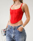 Knit lace bustier top. Adjustable straps. Boning in bodice. Back hook and eye closures. Fully lined. Going out top. Red tank top. Red bustier top. Red corset top.