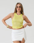 Woven mini skirt. Side hook and eye and zipper closures. Front slit. Fully lined. White mini skirt. Going out skirt. Summer outfit