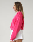 Graphic printed knit sweatshirt. Cropped fit. Unlined. Pink cropped oversized sweater. Airport outfit. Loungewear. Relaxing outfit.