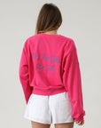 Graphic printed knit sweatshirt. Cropped fit. Unlined. Pink cropped oversized sweater. Airport outfit. Loungewear. Relaxing outfit.